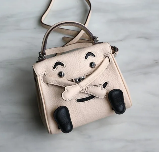 handbag with a monster cartoon bag