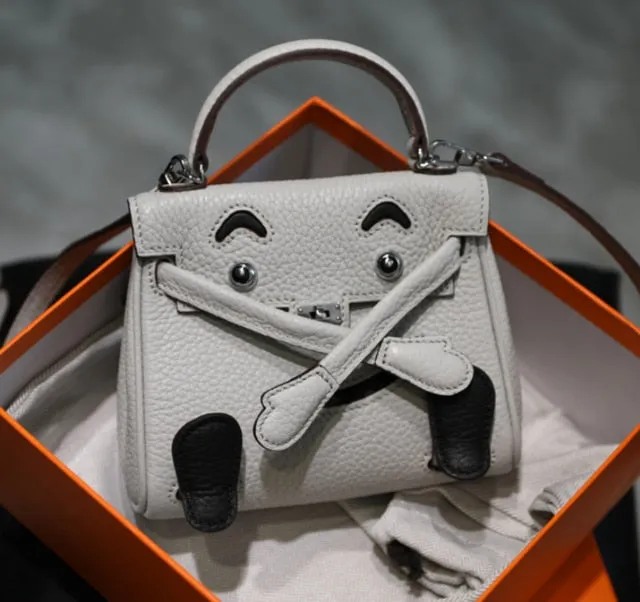 handbag with a monster cartoon bag