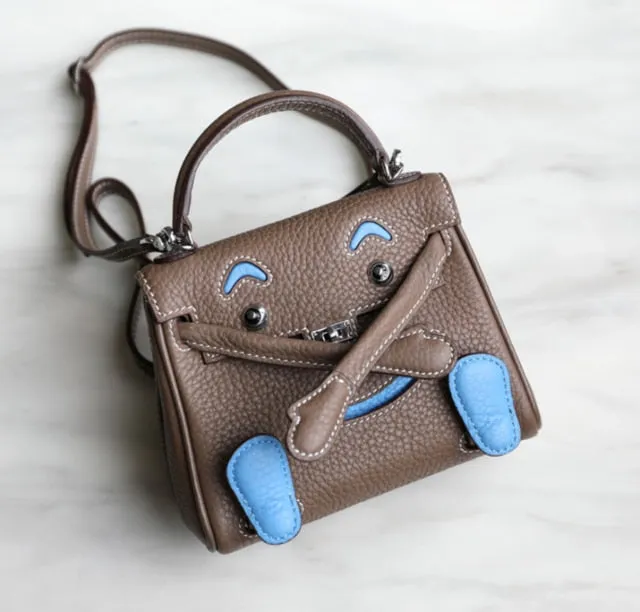 handbag with a monster cartoon bag