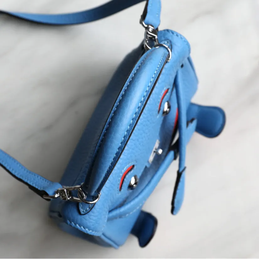 handbag with a monster cartoon bag