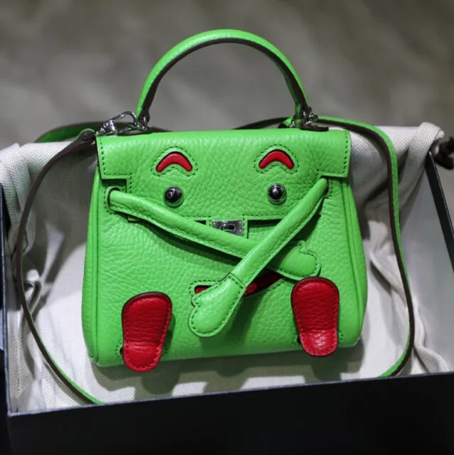 handbag with a monster cartoon bag